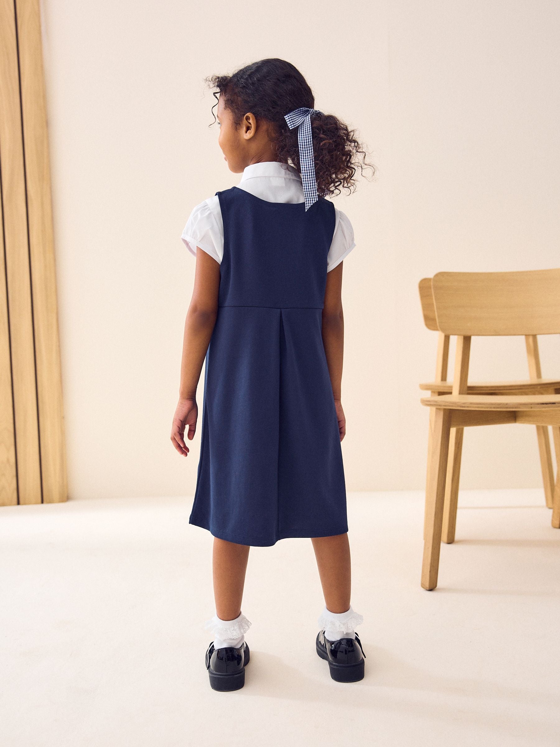 Navy Jersey Stretch Bow School Pinafore (3-14yrs)